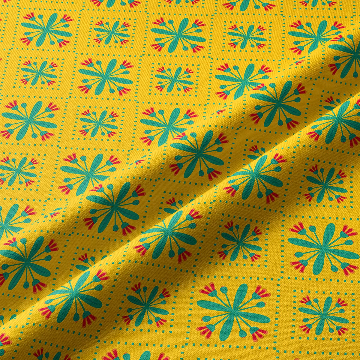 Zbliżenie na tkaninę bieżnika pokazujące turkusowe kwiatuszki i czerwone akcenty w kratkowym układzie punktów