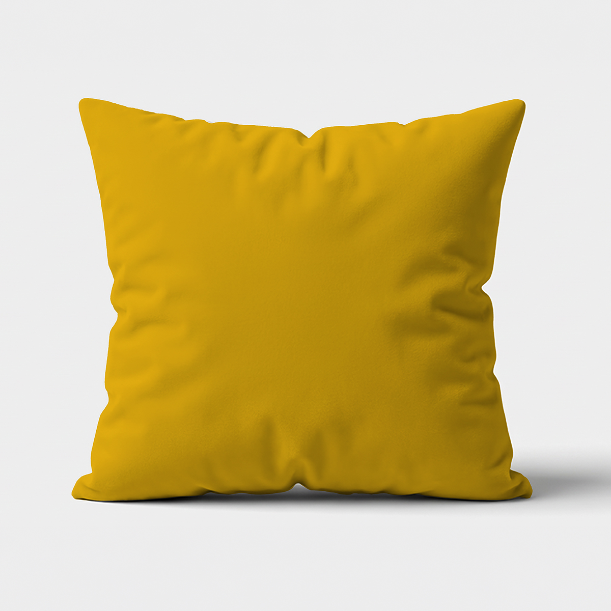 gładka musztardowa poduszka dekoracyjna widok z przodu na jasnym tle