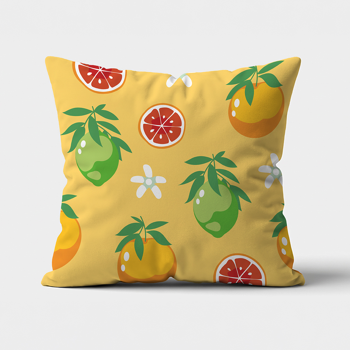 Główne ujęcie poduszki dekoracyjnej z żółtym tłem i wzorem limonek, pomarańczy i plastrów grejpfruta