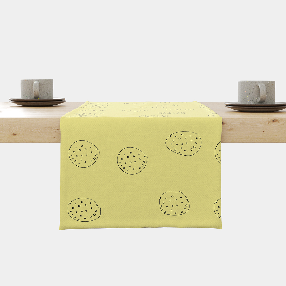 bieżnik na stole z widocznym wzorem łagodnych okręgów i dwoma filiżankami na końcach stołu