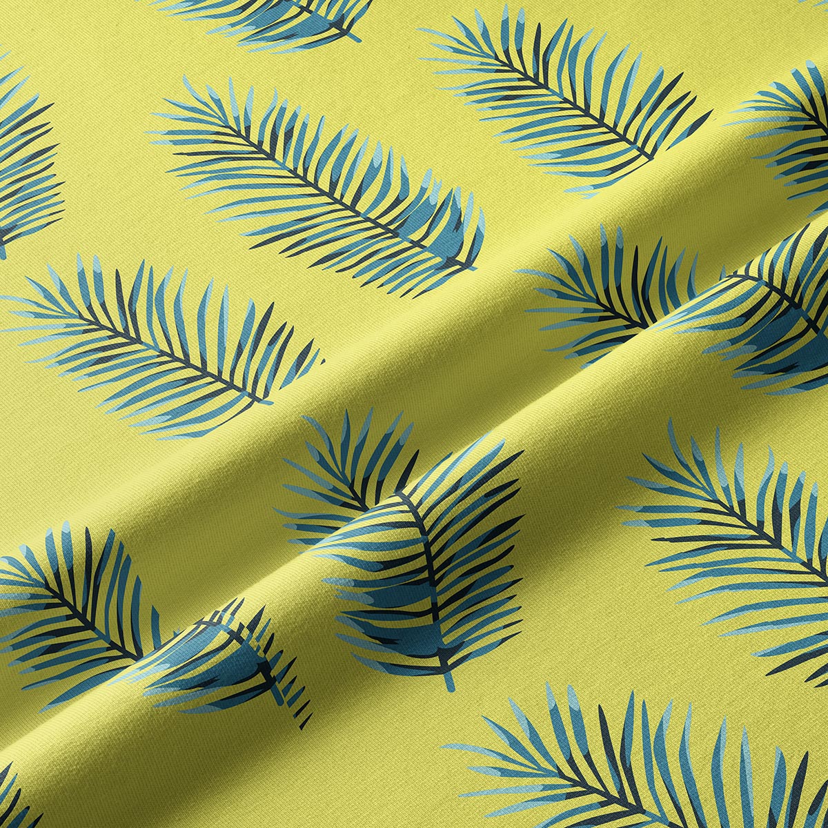 Zbliżenie na fakturę tkaniny i granatowo-niebieskie liście na limonkowym tle