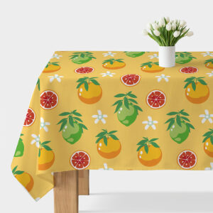 Obrus na stole z żółtym tłem ozdobiony pomarańczami, limonkami i białymi kwiatkami