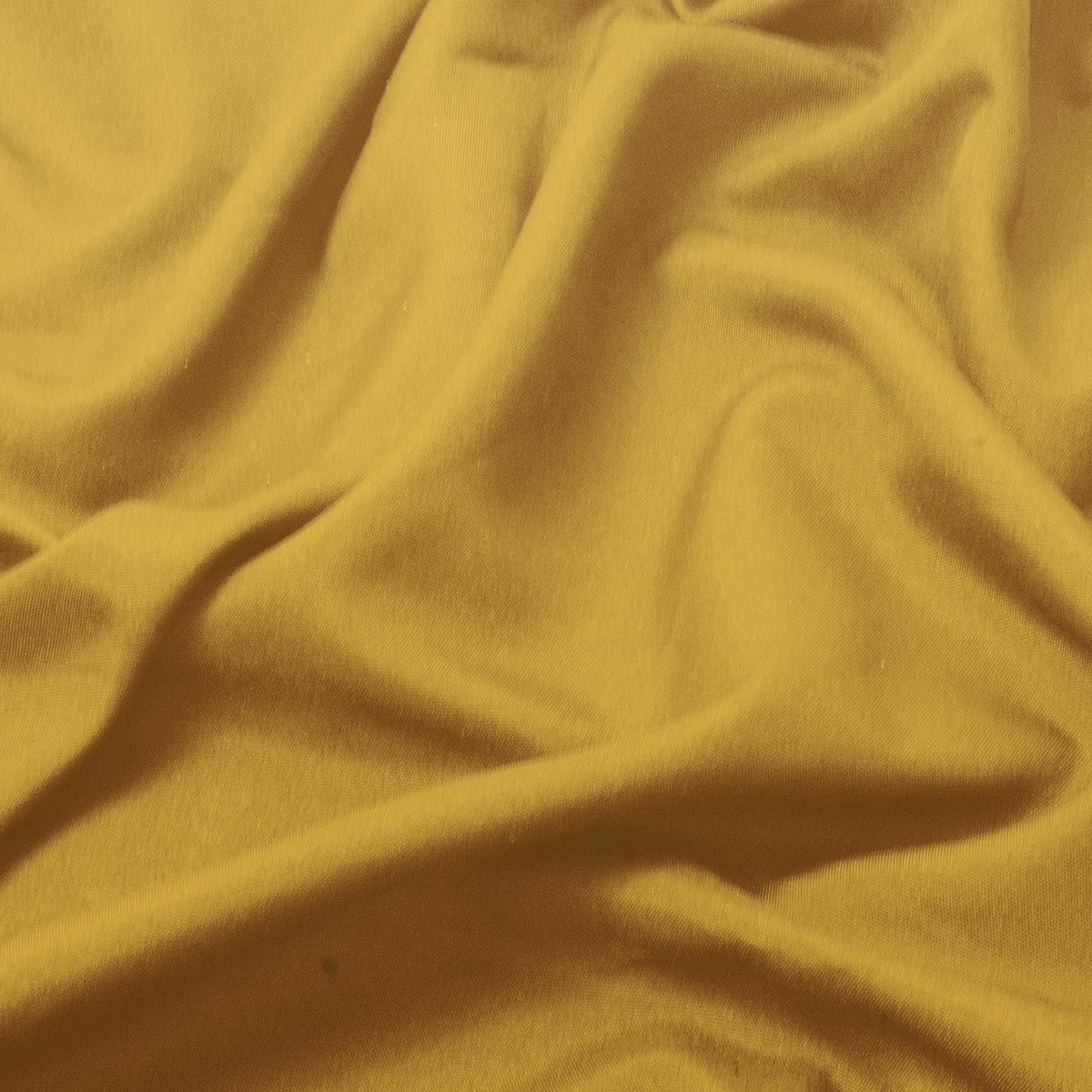 zbliżenie tkaniny obrusu ukazujące fakturę i miękkie fałdy