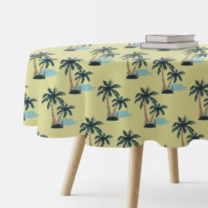 okrągły obrus z motywem palm na jasnozielonym tle, główne ujęcie stołu z książkami